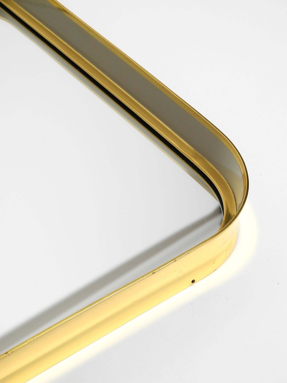 Mid Century Modern Wall Mirror With Heavy Brass Frame By Münchener Zierspiegel photo vintage
