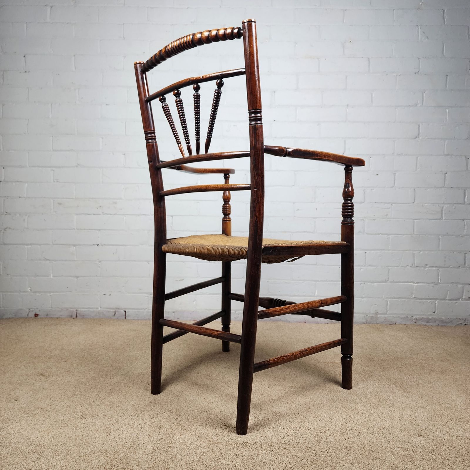 A George III Elm And Fruitwood Spindle Back Carver Chair photo 750.0