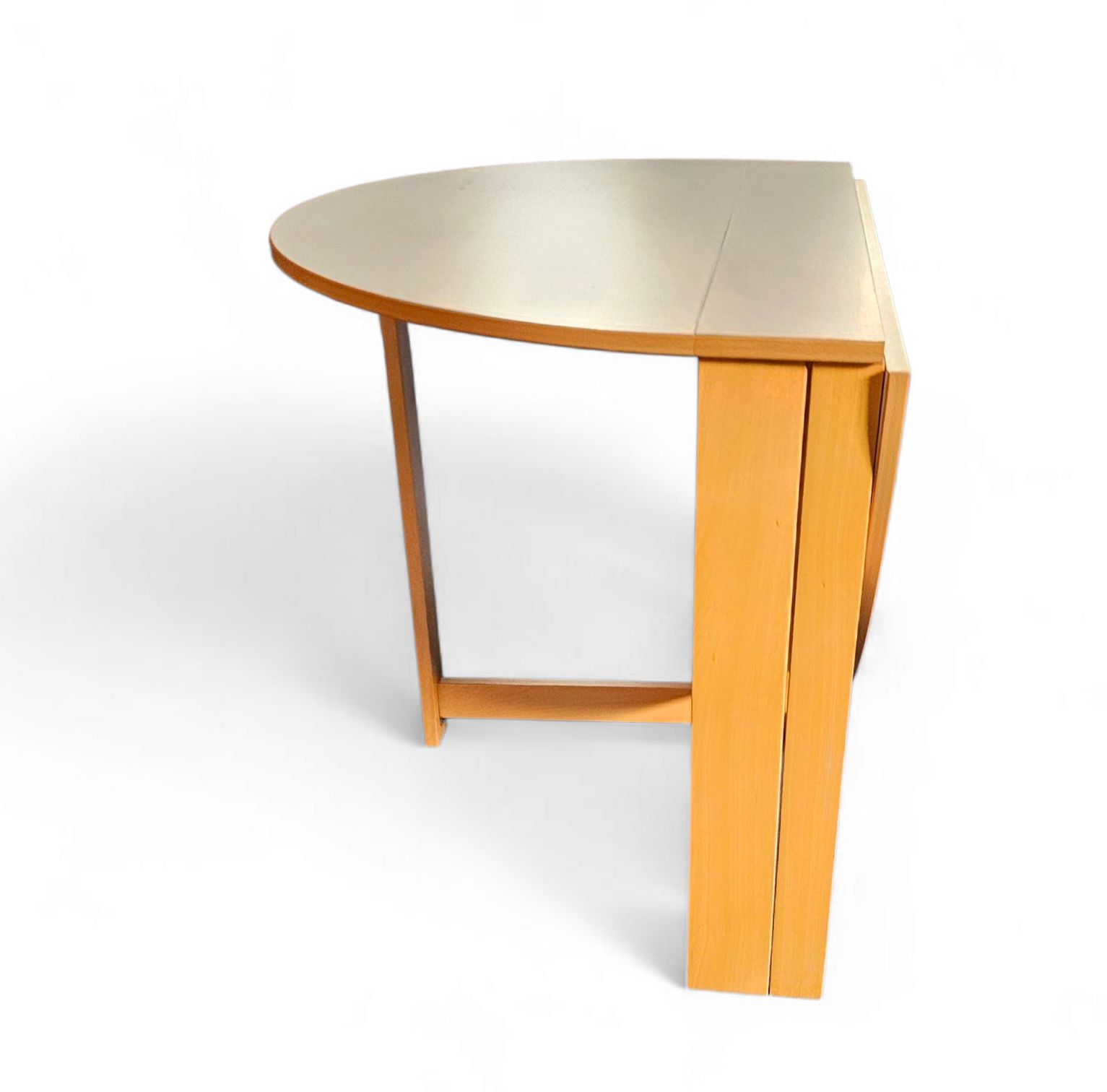 Vintage Scandinavian Folding Dining Table With Side Leaves. The Oval Top Is Made Of White Formica photo vinterior