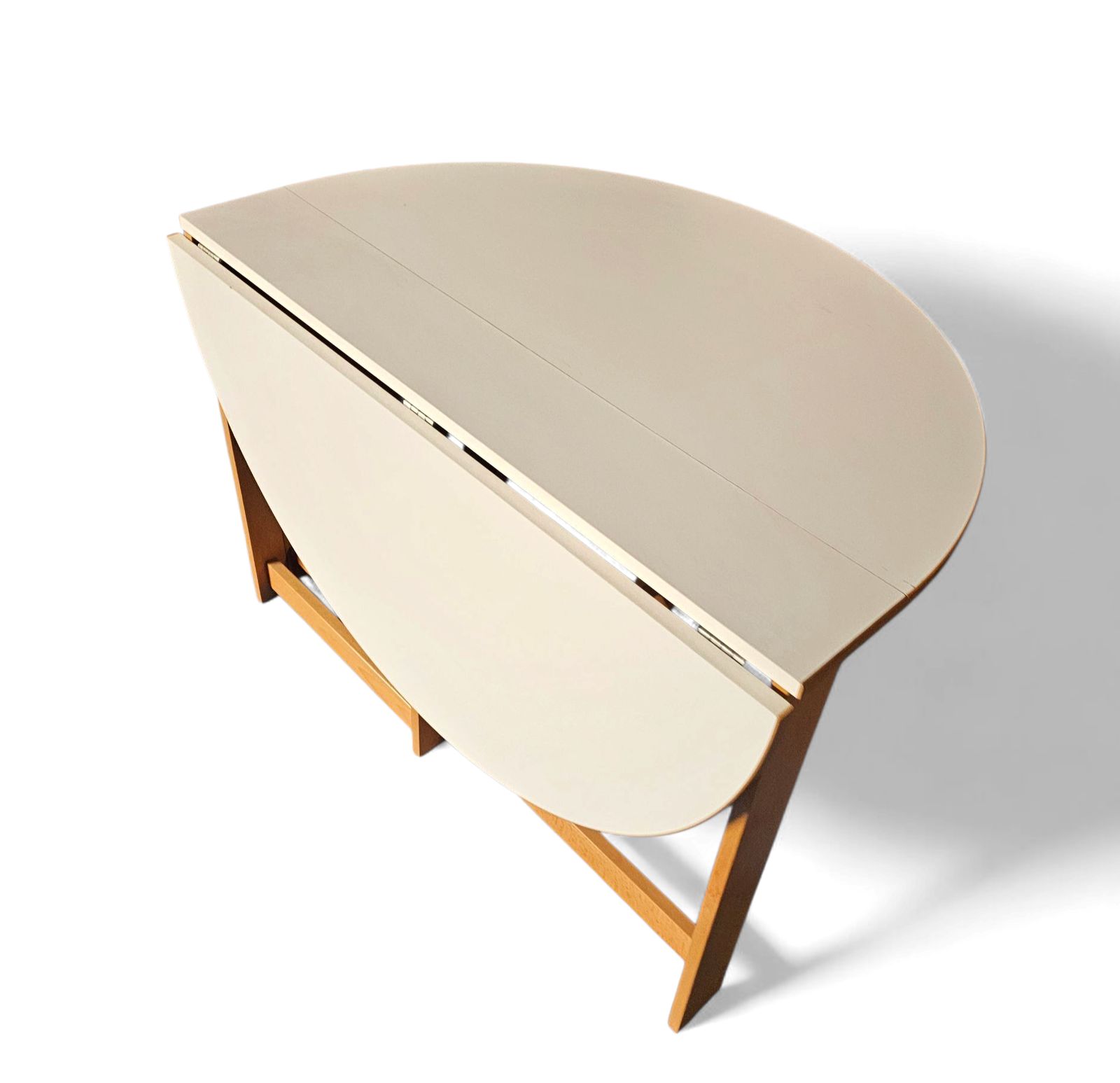 photo vinterior Vintage Scandinavian Folding Dining Table With Side Leaves. The Oval Top Is Made Of White Formica