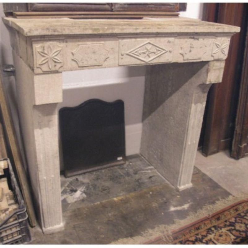 Fireplace Mantel Carved In Grey Stone With Decorations, France photo Home Fixtures