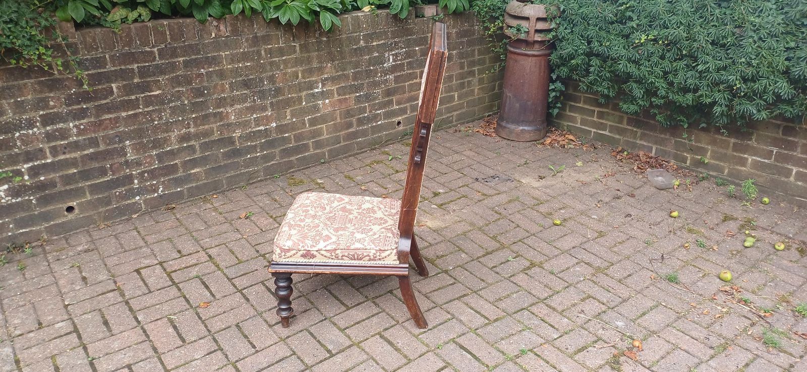 photo furniture Antique Victorian Aesthetic Movement Nursing Chair With Ornate Carved Scrolls & T Shaped Upholstered Back C1870s Mahogany