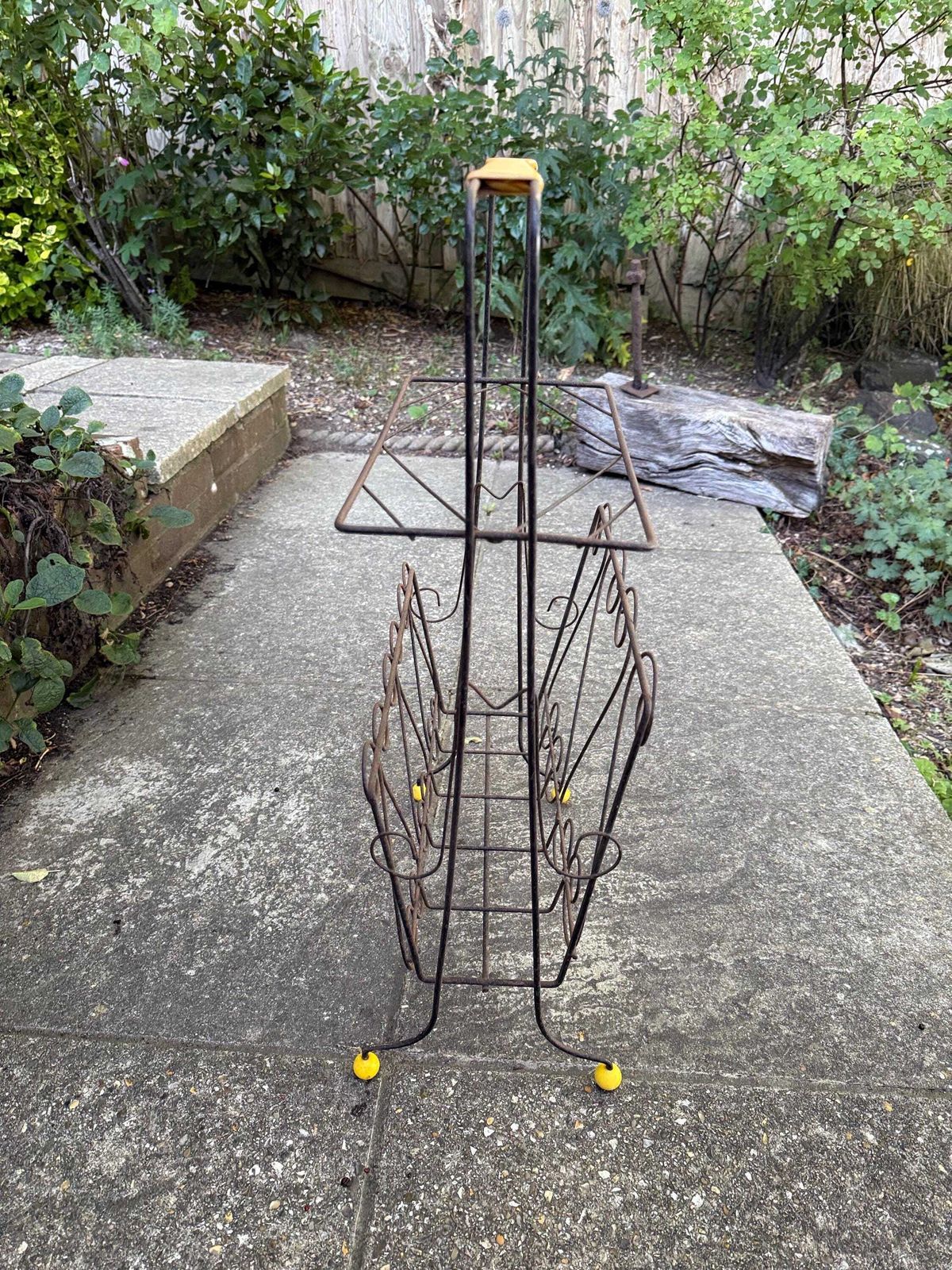 Vintage 1950s Wire Magazine Rack – Mid Century Scrollwork Storage Stand With Original Yellow Feet & Handle, Vintage Storage Rack   Towels? photo vinterior