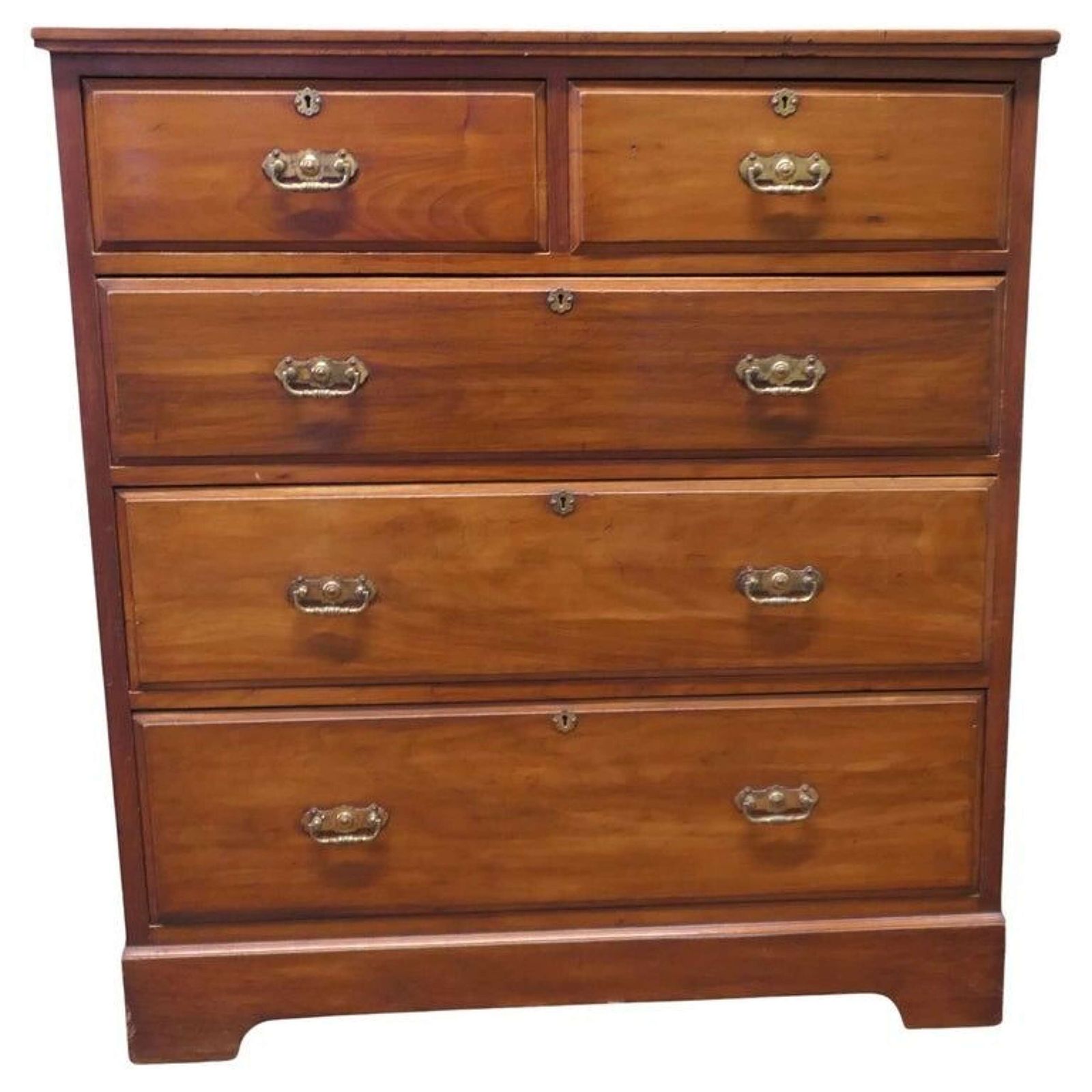 A Large Edwardian Walnut Chest Of Drawers