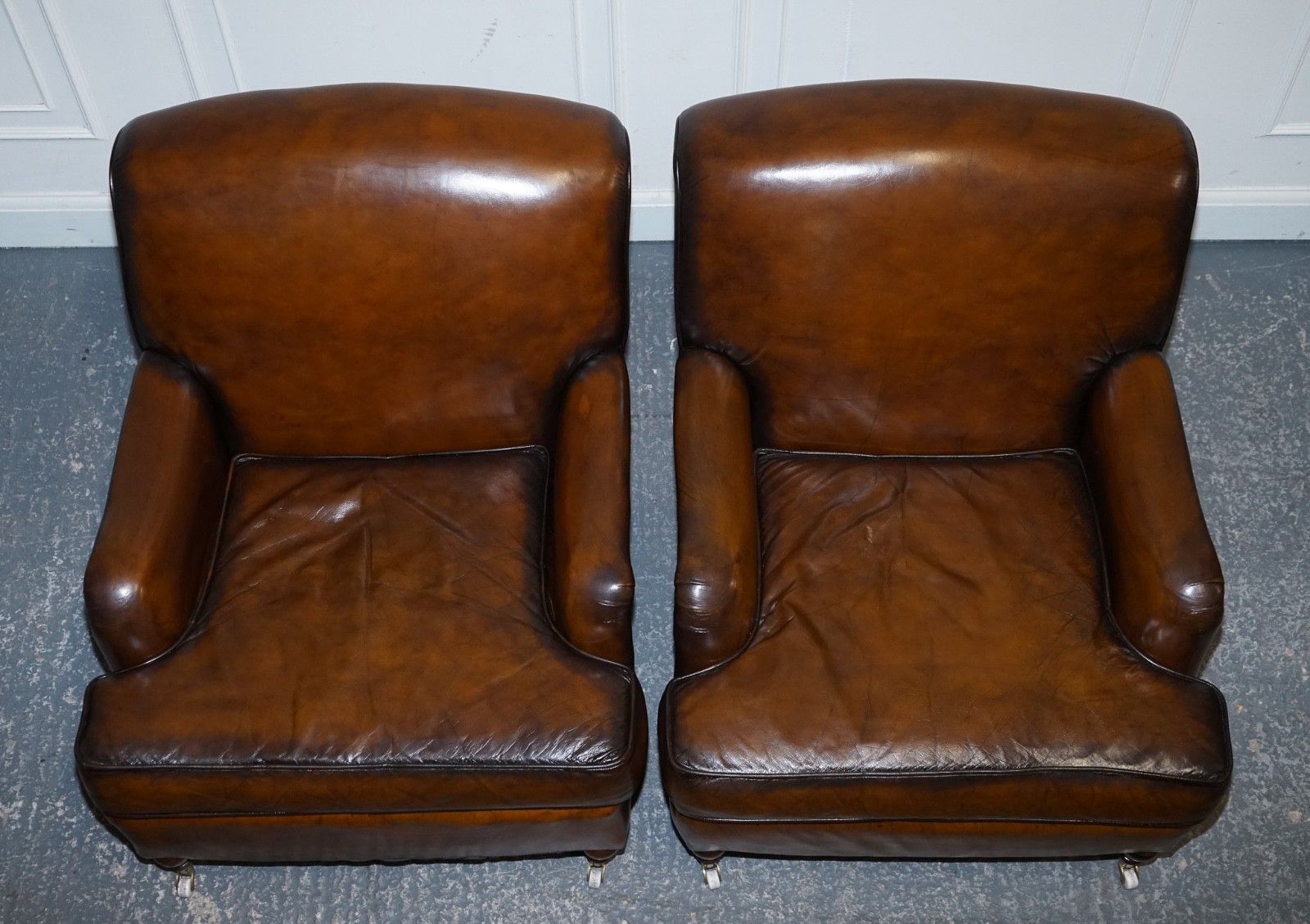 photo furniture Pair Of Cigar Hand Dyed Leather Howard & Sons Style Armchairs On Castor Feet