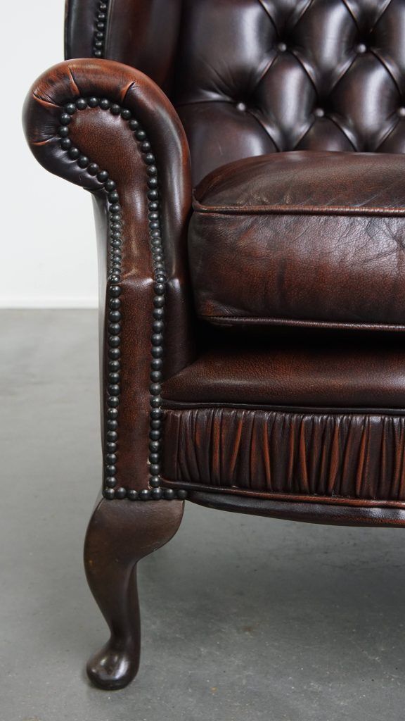 photo for sale Luxueuze Chesterfield Wingback Fauteuil In Warm Bruin Koeienhuid Met Unieke Details