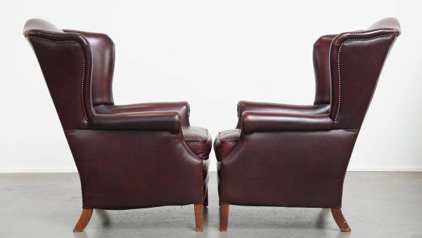 Set Of 2 Beautiful And Comfortable Burgundy Red Cowhide Wing Chairs In English Style With A Beautiful Patina photo furniture