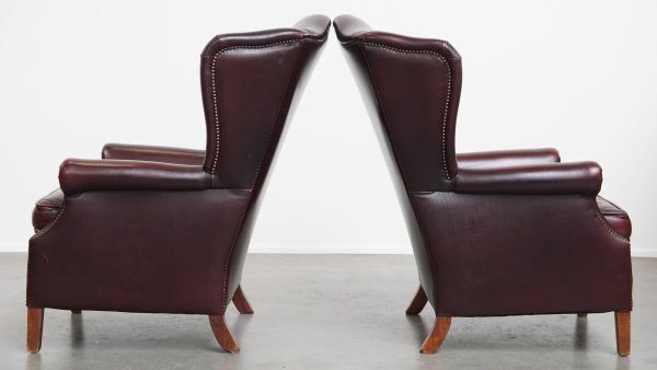 Set Of 2 Beautiful And Comfortable Burgundy Red Cowhide Wing Chairs In English Style With A Beautiful Patina photo 1895.0