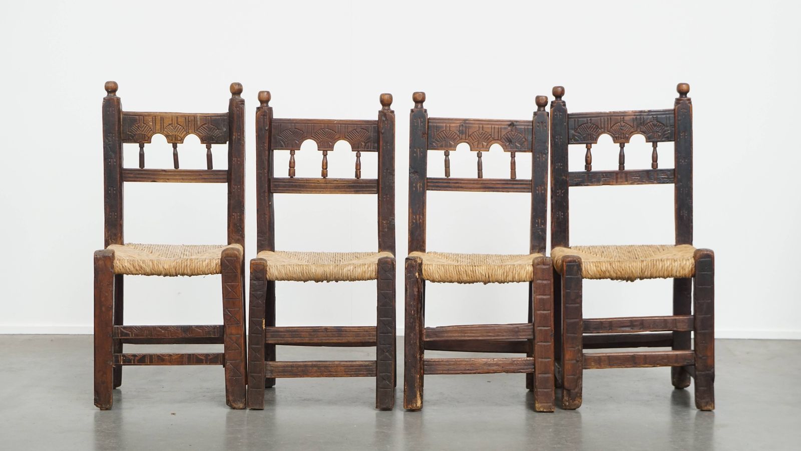 Unique Set Of 4 Antique Spanish Farm Chairs With Woven Wicker Seats And Beautiful Wood Carvings photo furniture