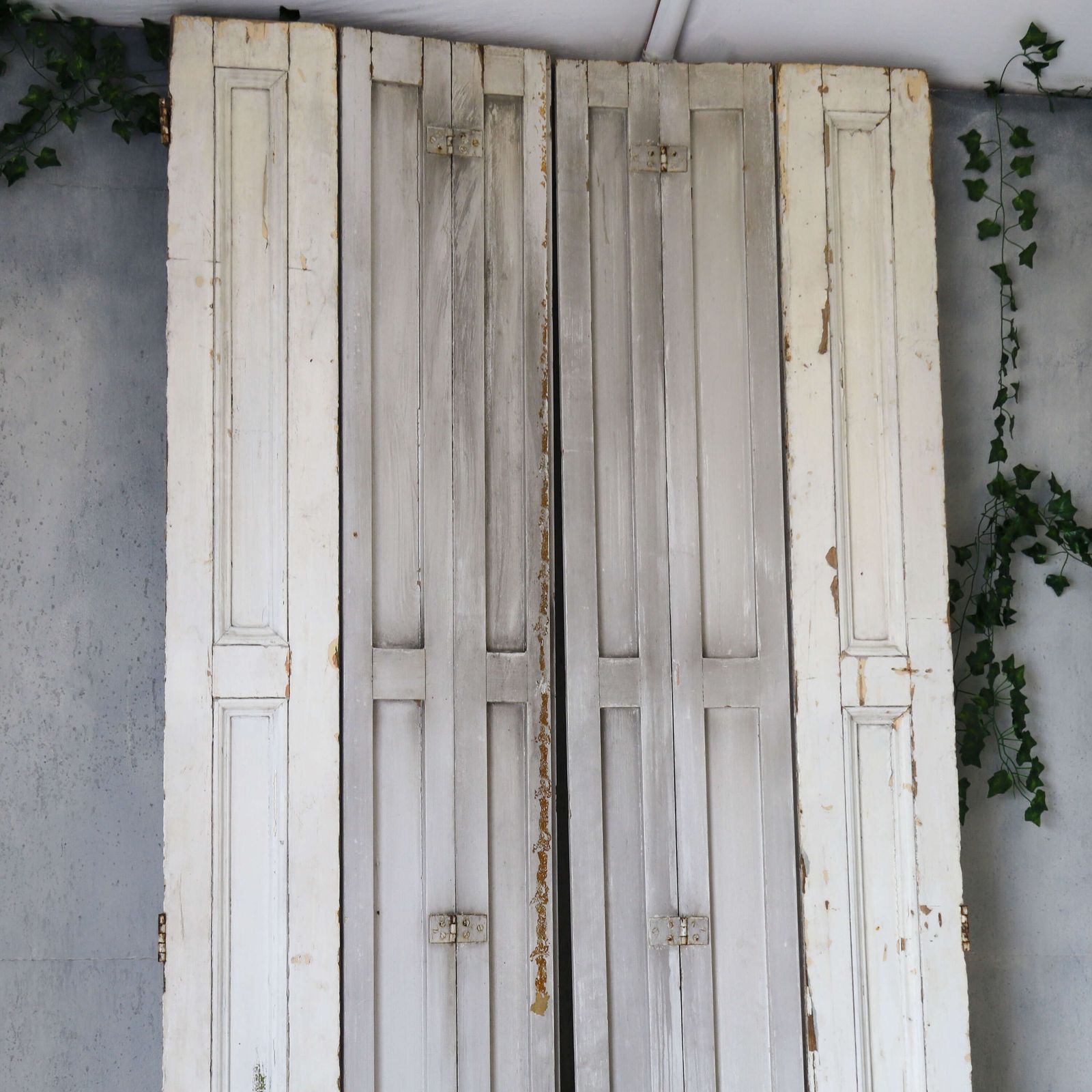 photo for sale Pair Of Antique Panelled Tri Folding Shutters In Original Cream Paint