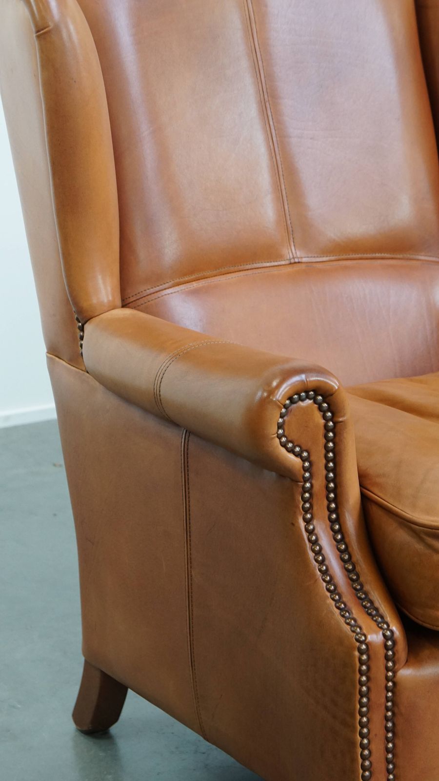 photo vintage Classic And Unique Set Of 2 Cowhide Wing Chairs Finished With Decorative Nails And Beautiful Details