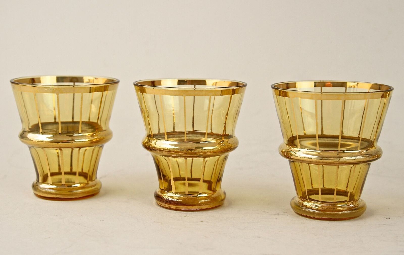 photo vintage 20th Century Art Deco Glass Decanter Set, Amber Colored/ Gilt   Cz Ca. 1920