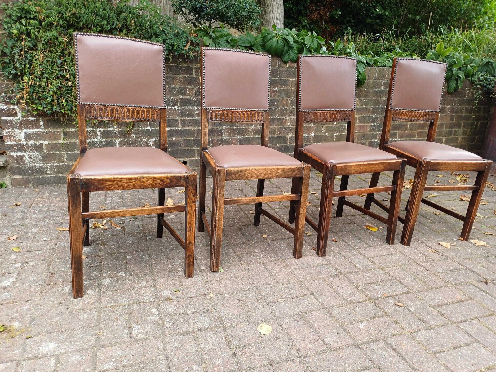 photo furniture Set Of 4 Antique Oak Dining Chairs With Carved Backs & Studded Faux Leather Seats Early 20th Century Arts And Crafts Style