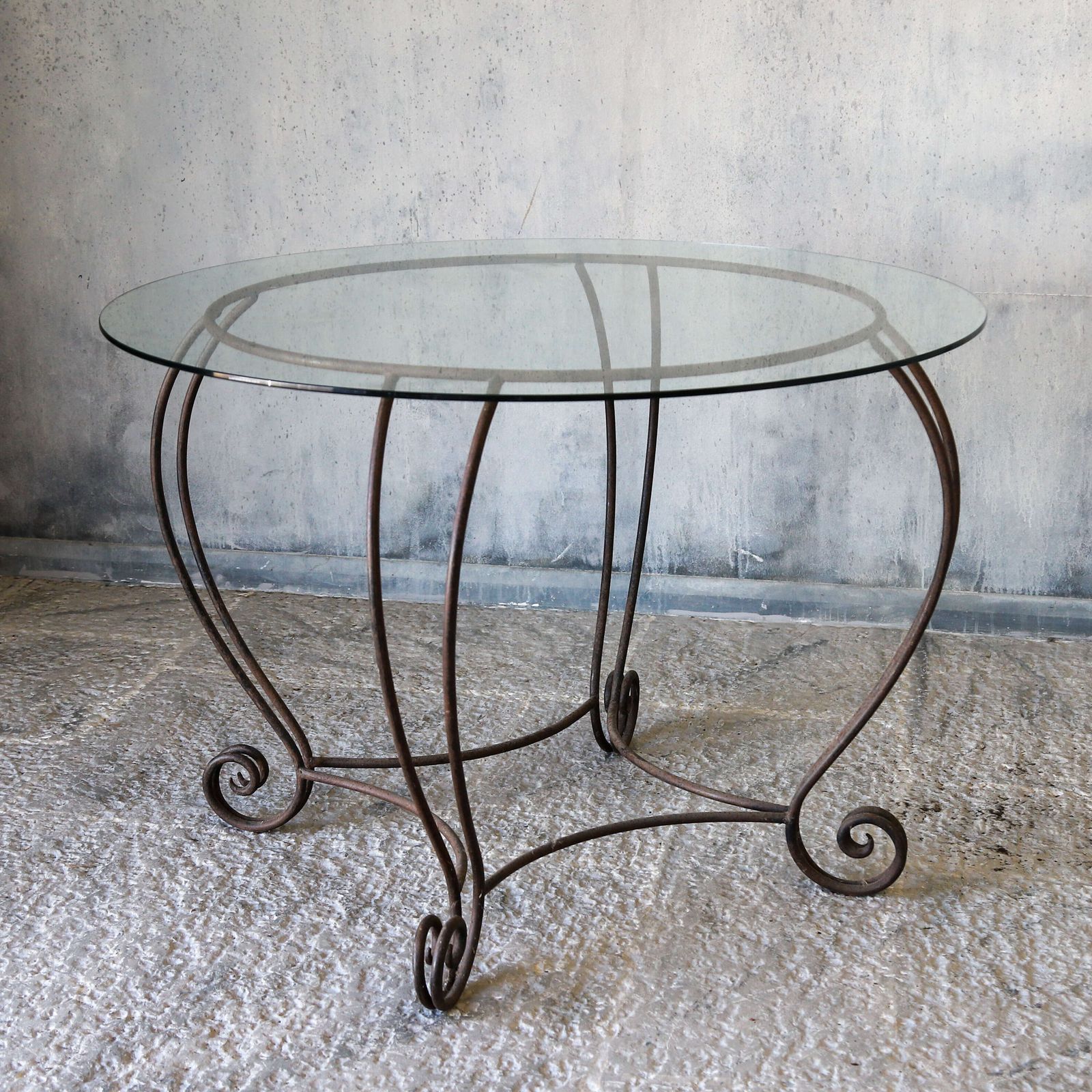 Stylish Mid Century Circular Table With Bevelled Glass Top And Decorative Metal Base photo vintage