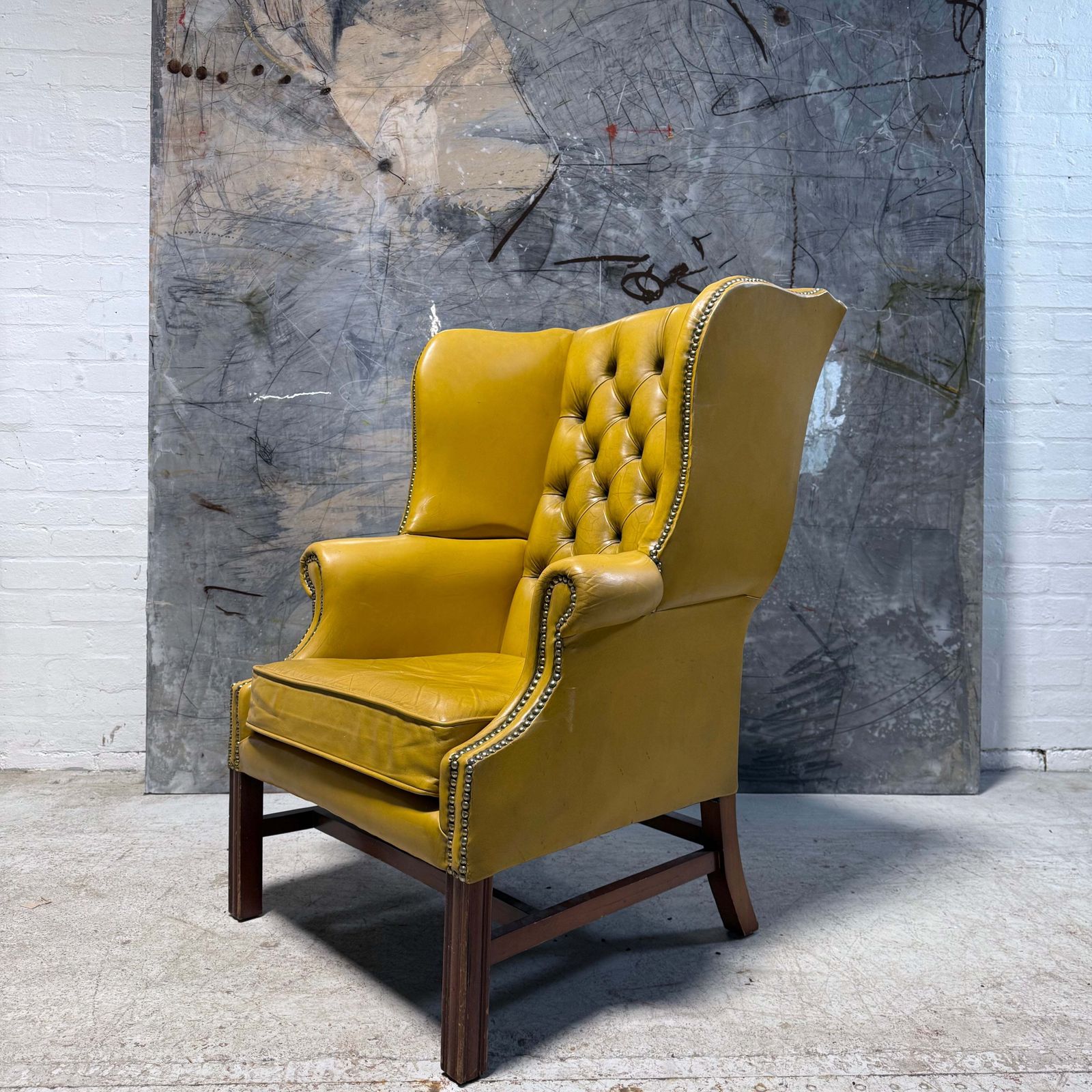 Vintage Leather Chesterfield Wing Chair In Soft Lemon photo vinterior