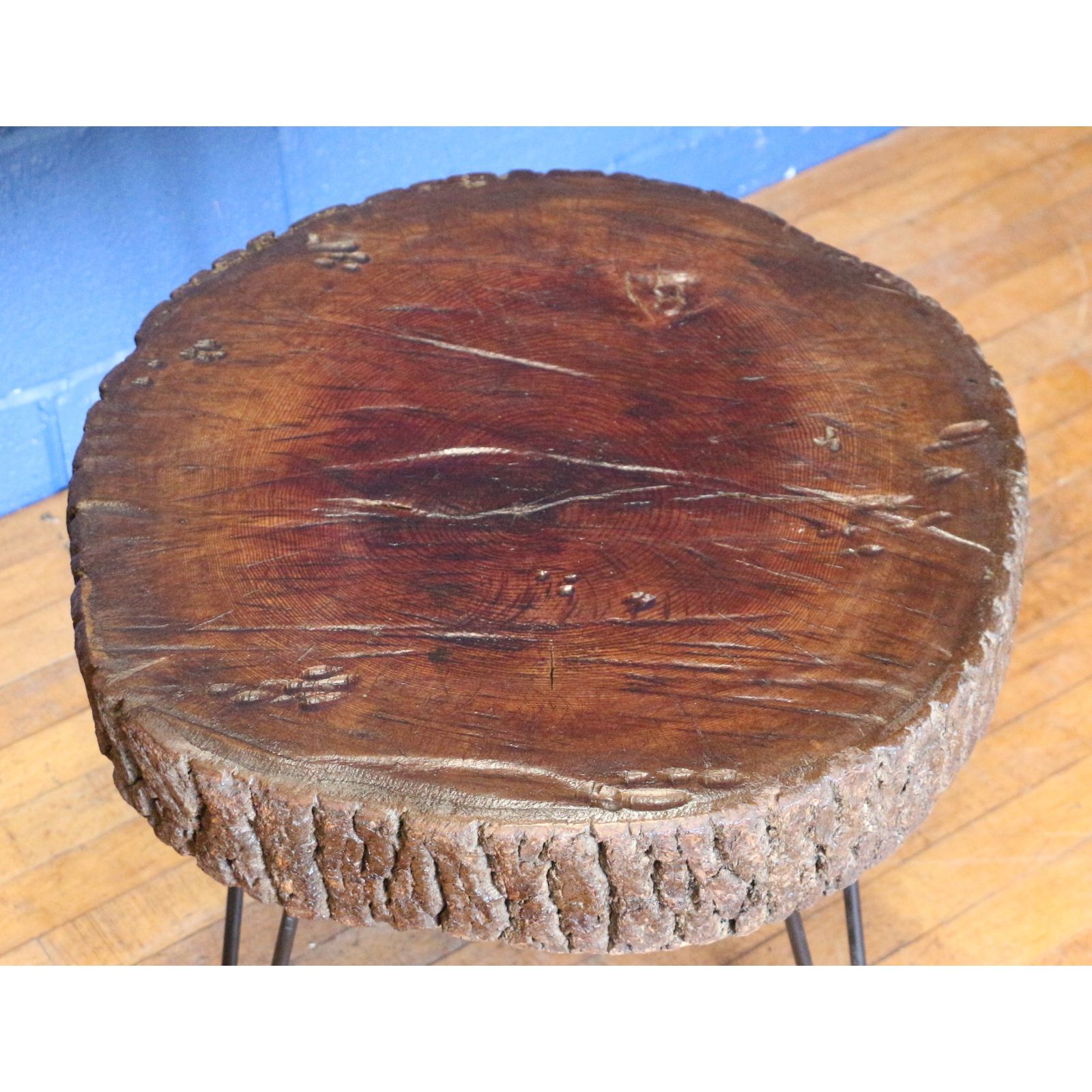 A Rustic Waxed And Polished Tree Slice Coffee Table With Live Edge And Hairpin Legs photo 90.0