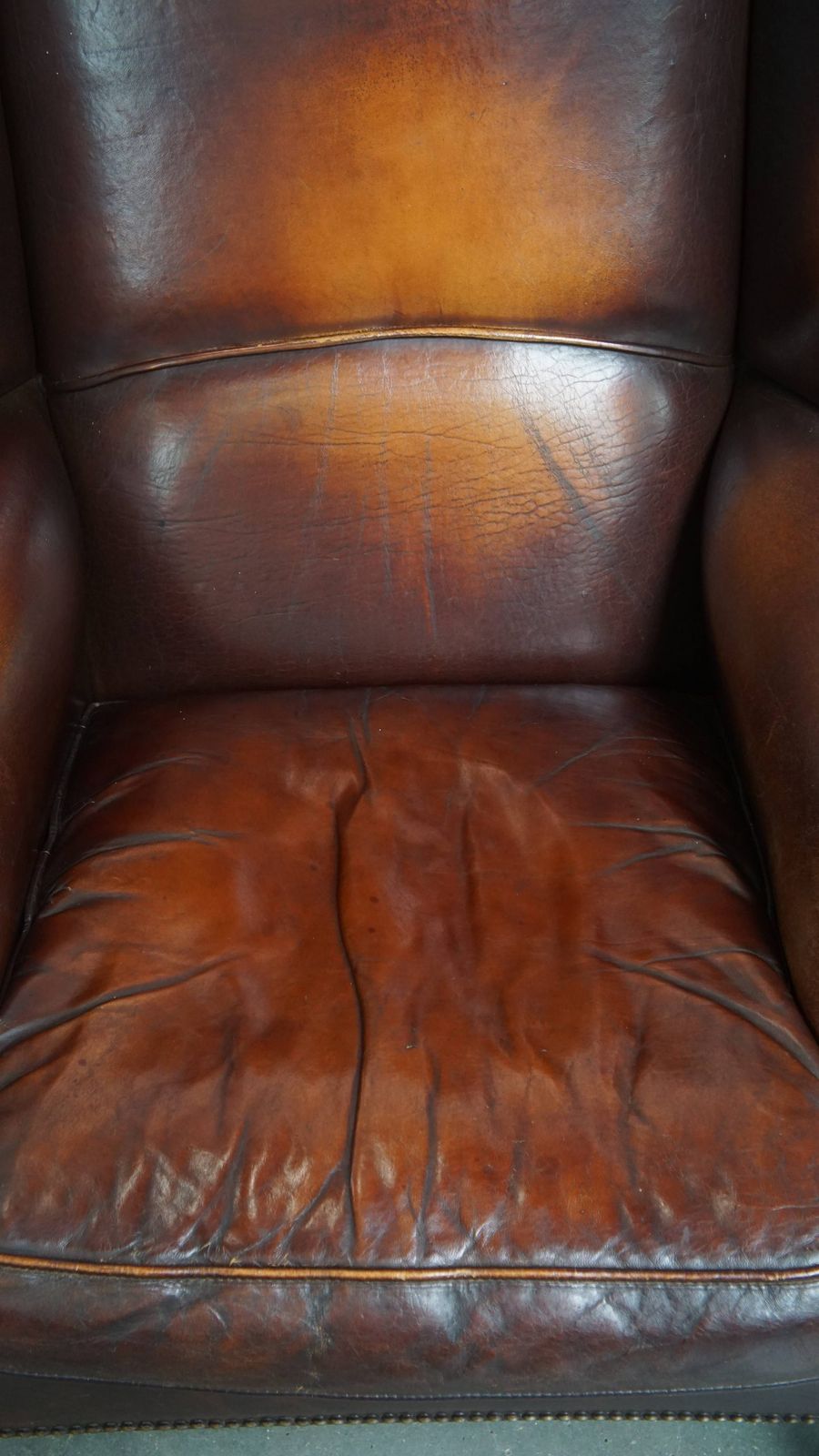 Luxurious, Classic And Comfortable Dark English Style Sheepskin Wing Chair With Lots Of Character And A Beautiful Patina photo vinterior