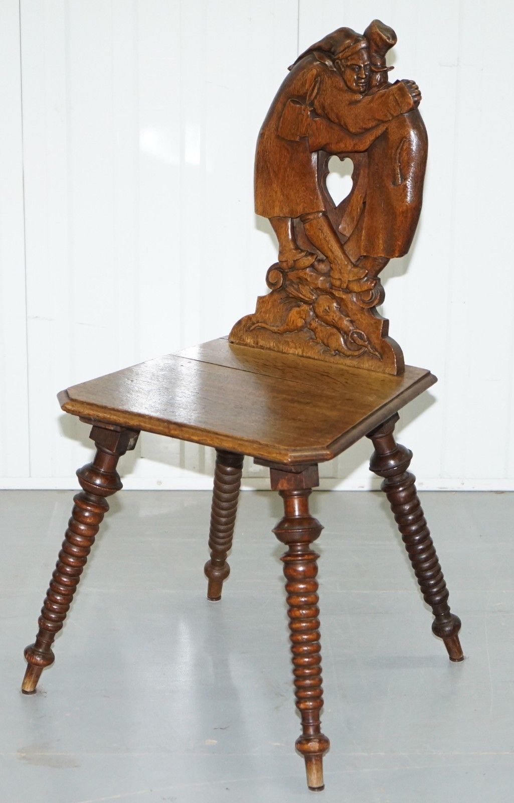 Black Forest Carve Oak Bobbin Hall Chair Depicting Two Friends Hugging Scrooge photo for sale