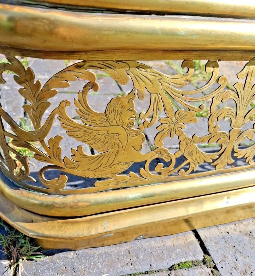 Antique Brass Fire Fender With Mythical Creatures And Urns photo 275.0