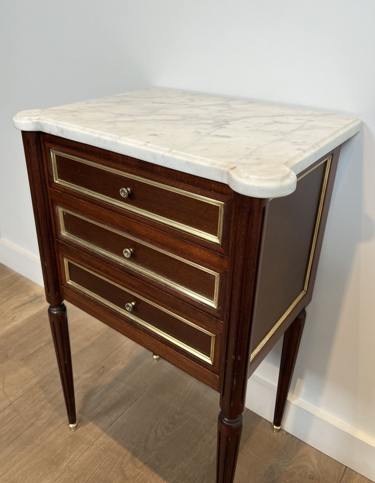 Pair Of Mahogany And Brass End Tables Or Bedside Tables With Carrara Marble Tops In The Style Of Maison Jansen. Circa 1940 photo vintage