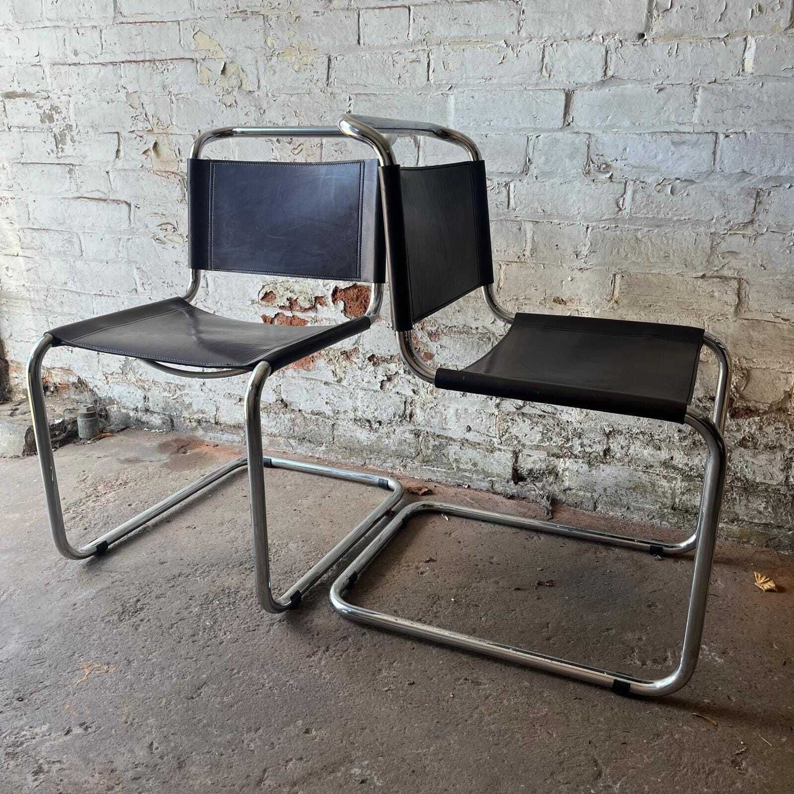 A Pair Of Chrome & Dark Brown Leather Cantilever Chairs
