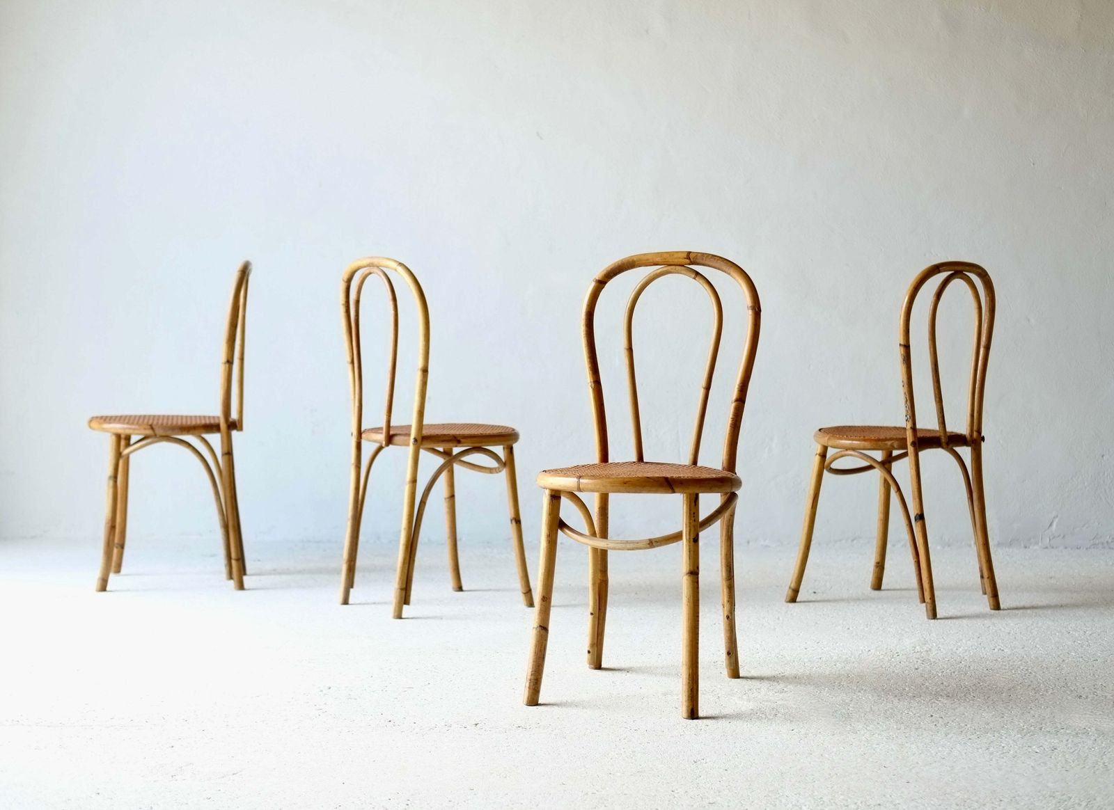 A Set Of Four French Midcentury Bamboo Dining Chairs photo furniture