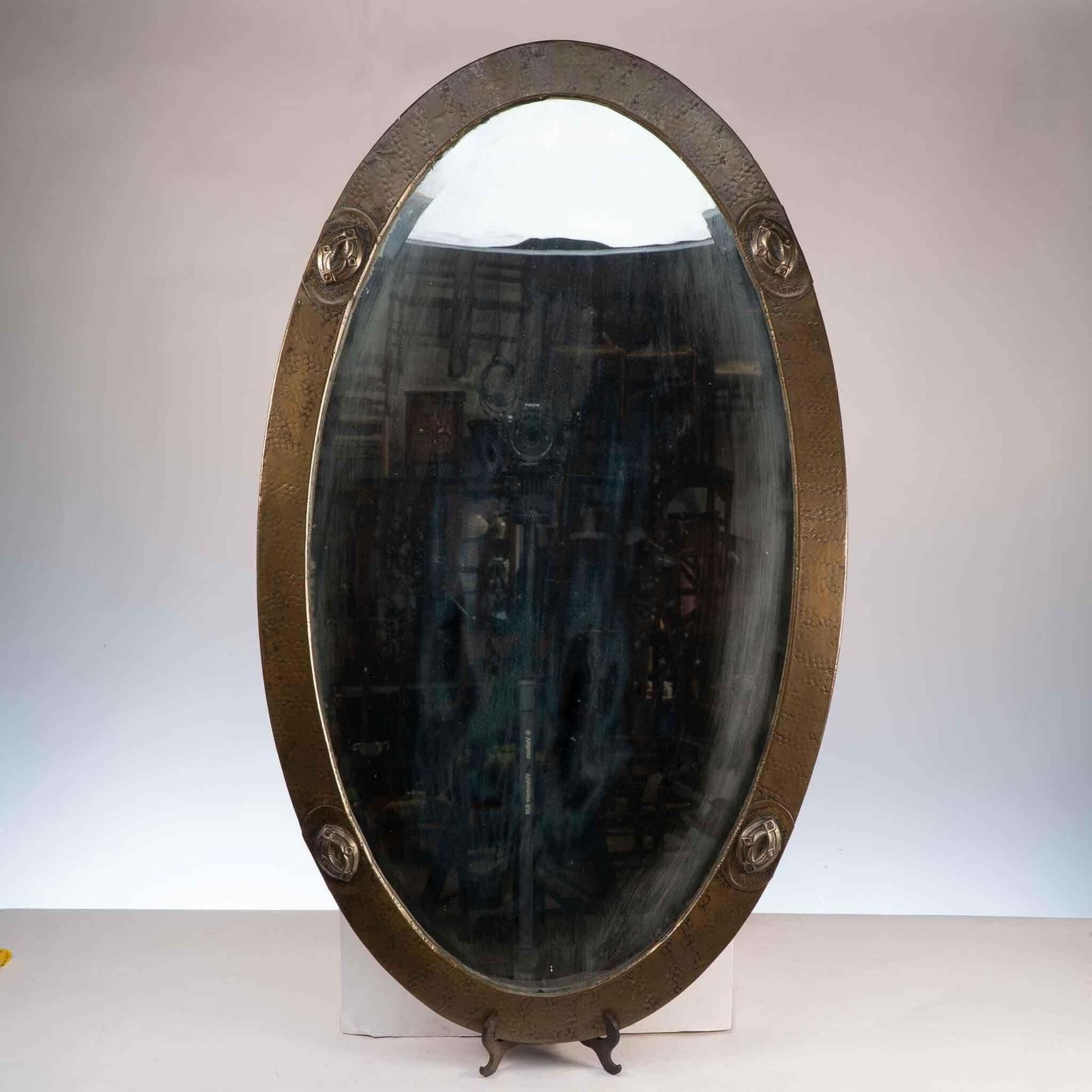 An Arts And Crafts Brass Hand Hammered Mirror With Four Celtic Style Details photo furniture