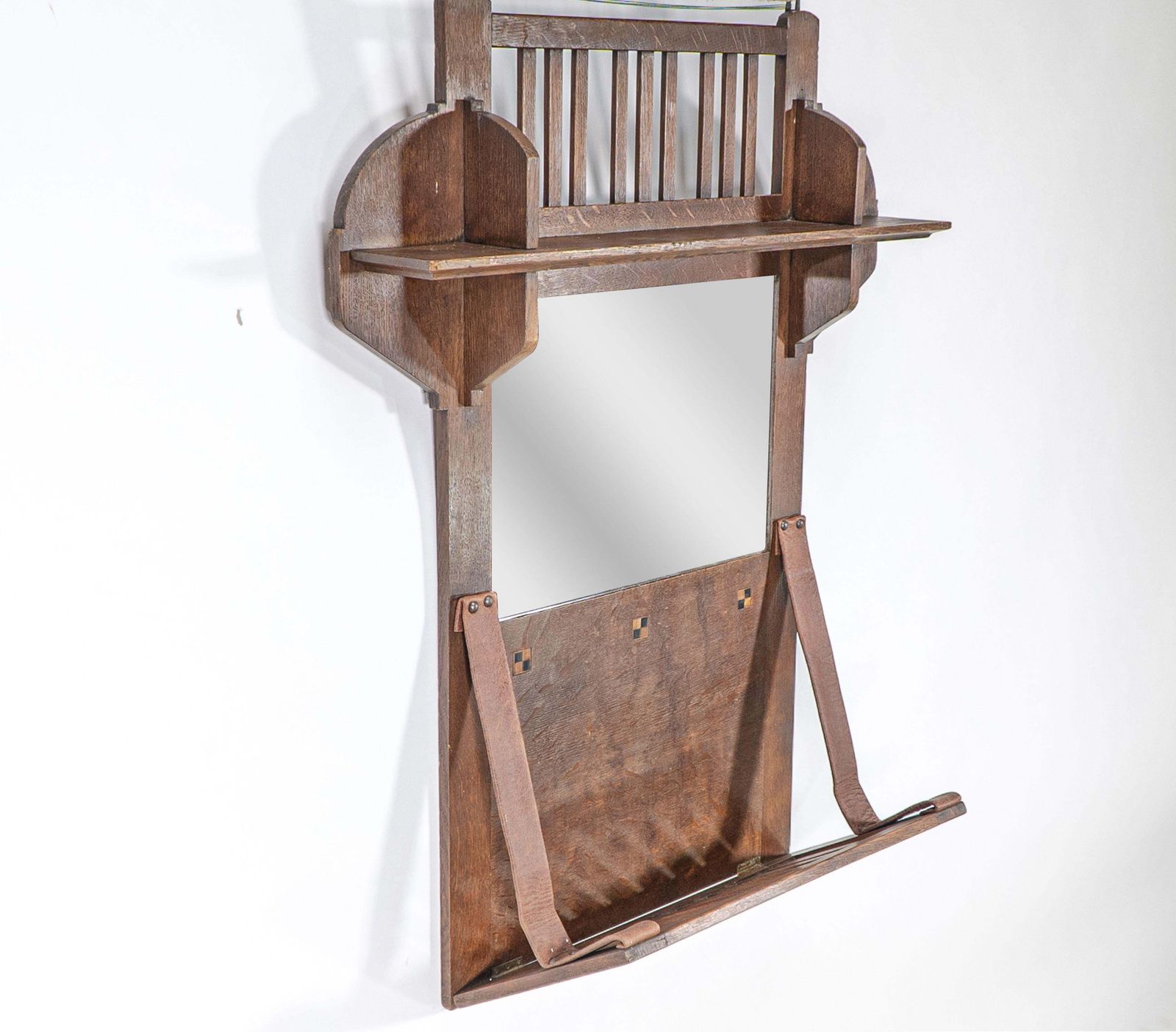 Liberty And Co. An Arts & Crafts Oak Hanging Paper Rack With Central Mirror photo for sale