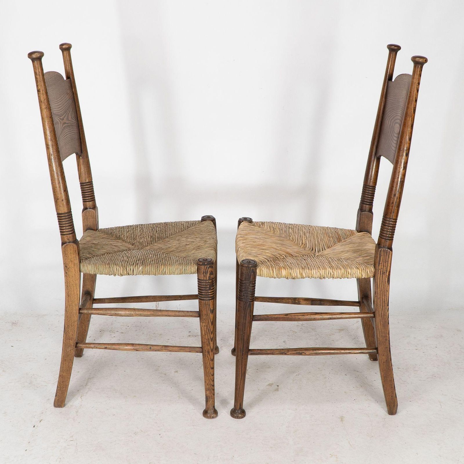 William Birch For Liberty & Co. A Pair Of Arts & Crafts Rush Seat Oak Chairs photo furniture