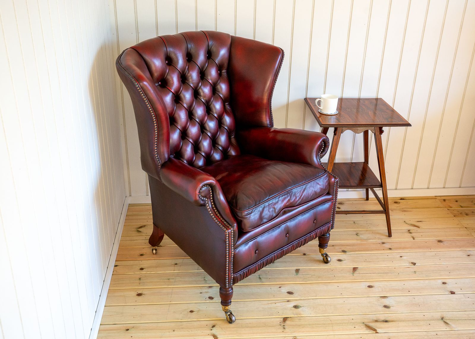 photo vintage Harrods Wingback Chesterfield Armchair Georgian Style Oxblood Red 1990s Casters Fireside Chair Fine Country House