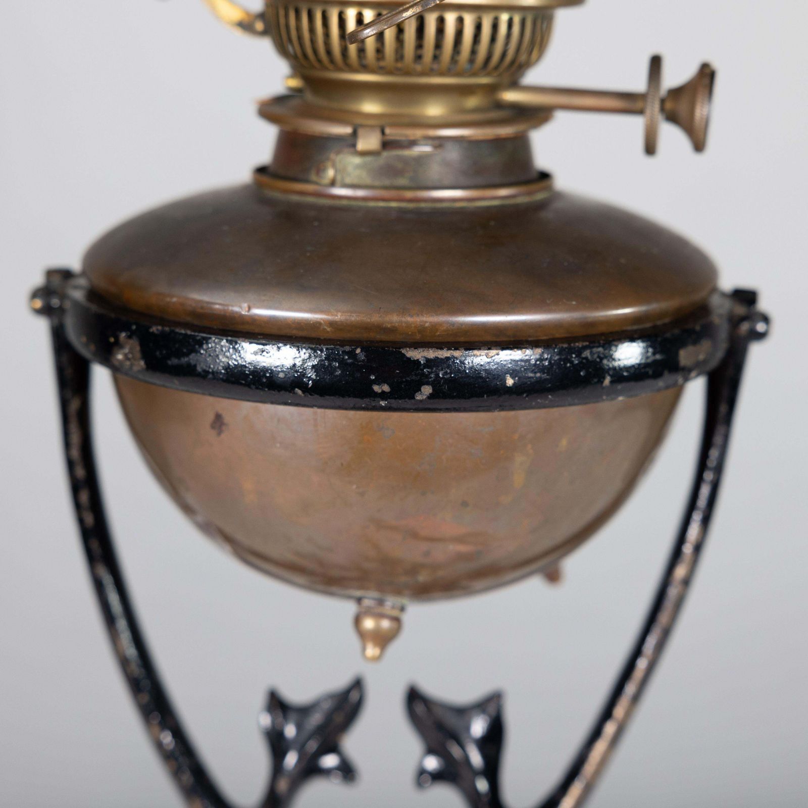 Lighting Was Benson. An Arts And Crafts Cast Iron Four Leg Table Oil Lamp photo