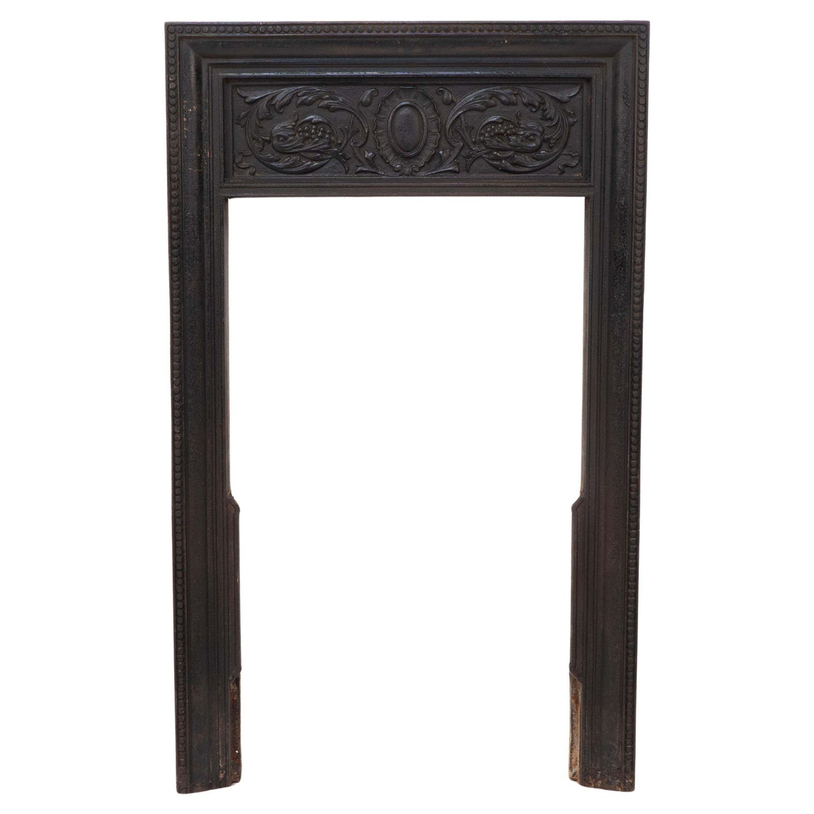 A Late Victorian Fireplace With Stylized Floral Details To The Top