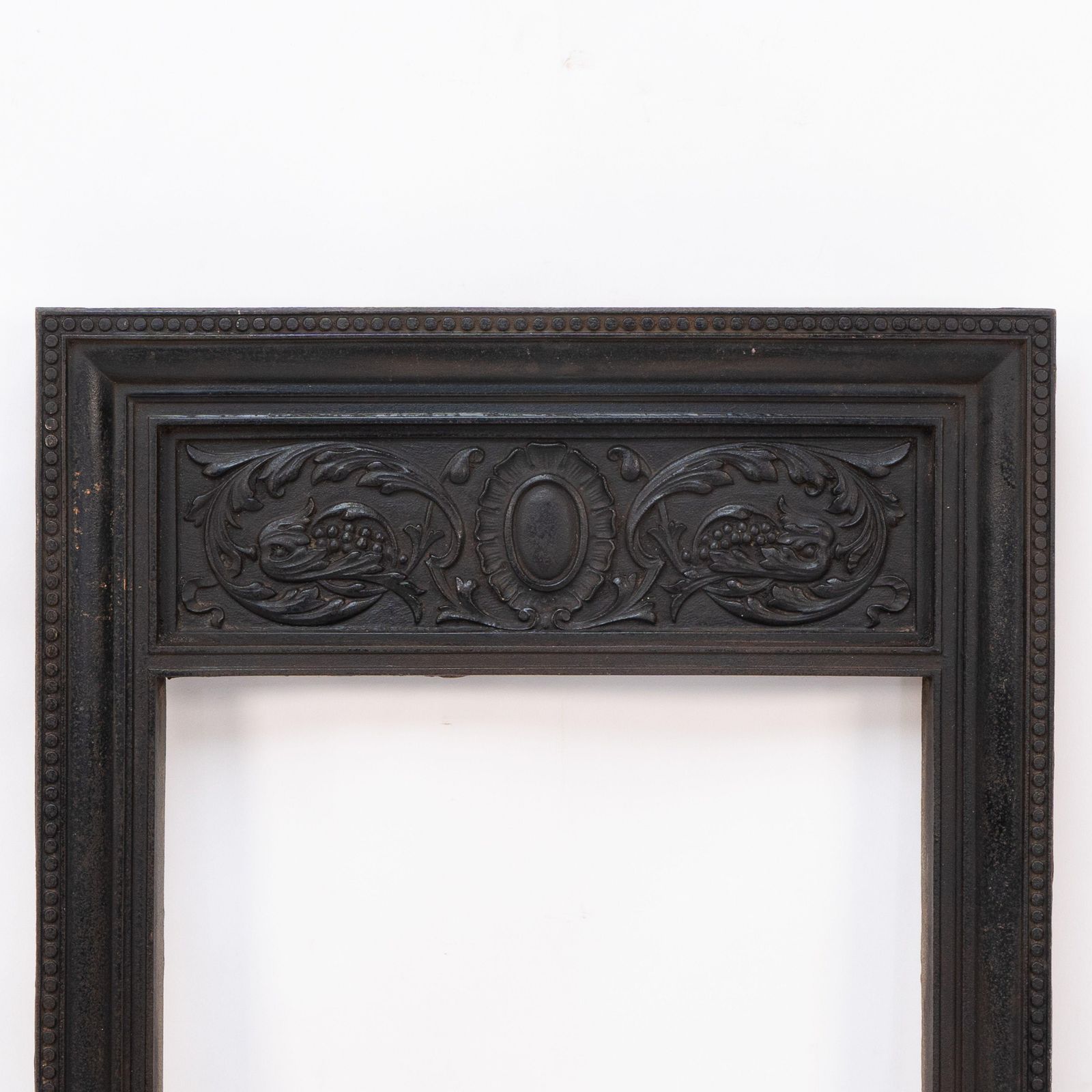 A Late Victorian Fireplace With Stylized Floral Details To The Top photo furniture