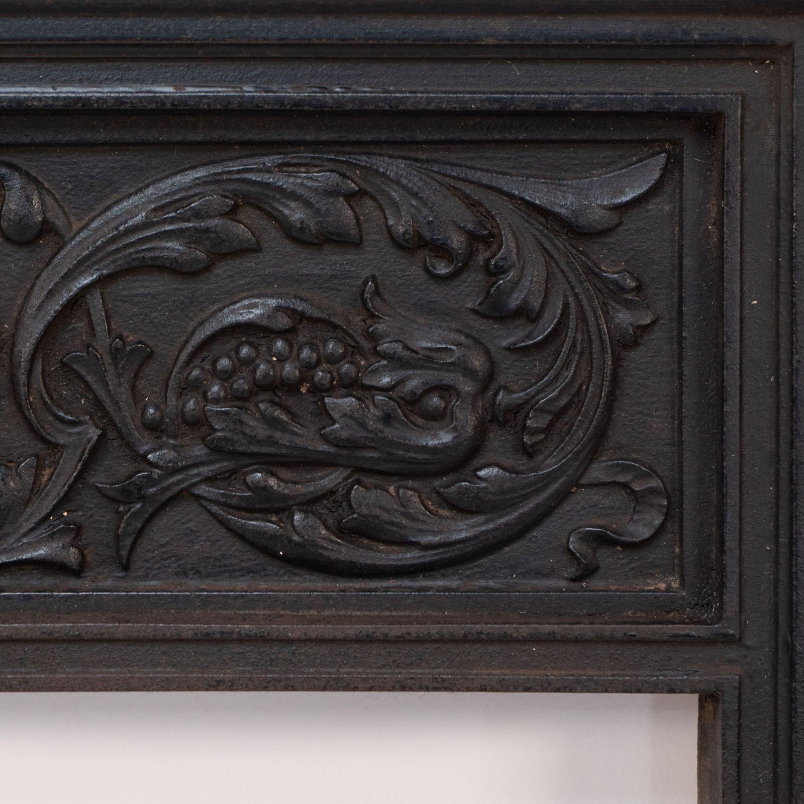 A Late Victorian Fireplace With Stylized Floral Details To The Top photo vinterior