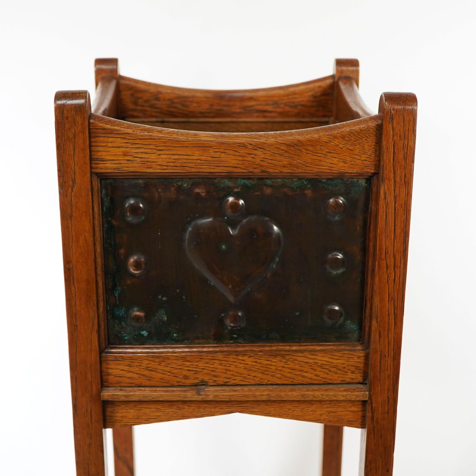 photo furniture Shapland & Petter. An Arts & Crafts Oak Planter With Copper Heart Shaped Panels