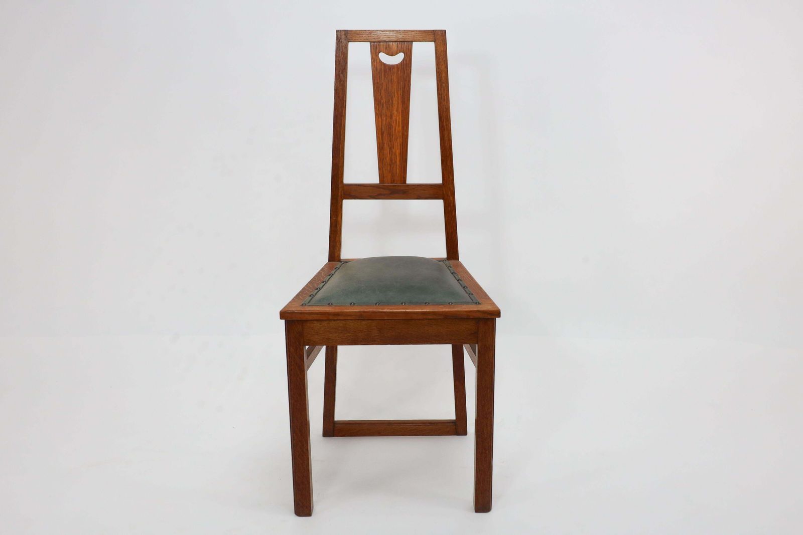 E A Taylor. A Set Of Five Arts And Crafts Oak Side Chairs With Heart Cut Outs. photo for sale