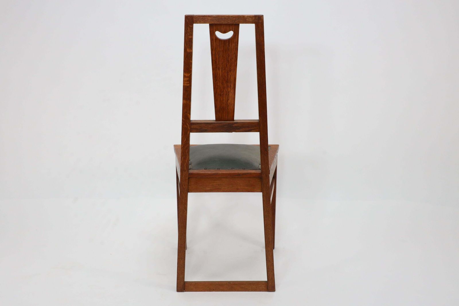 E A Taylor. A Set Of Five Arts And Crafts Oak Side Chairs With Heart Cut Outs. photo vinterior