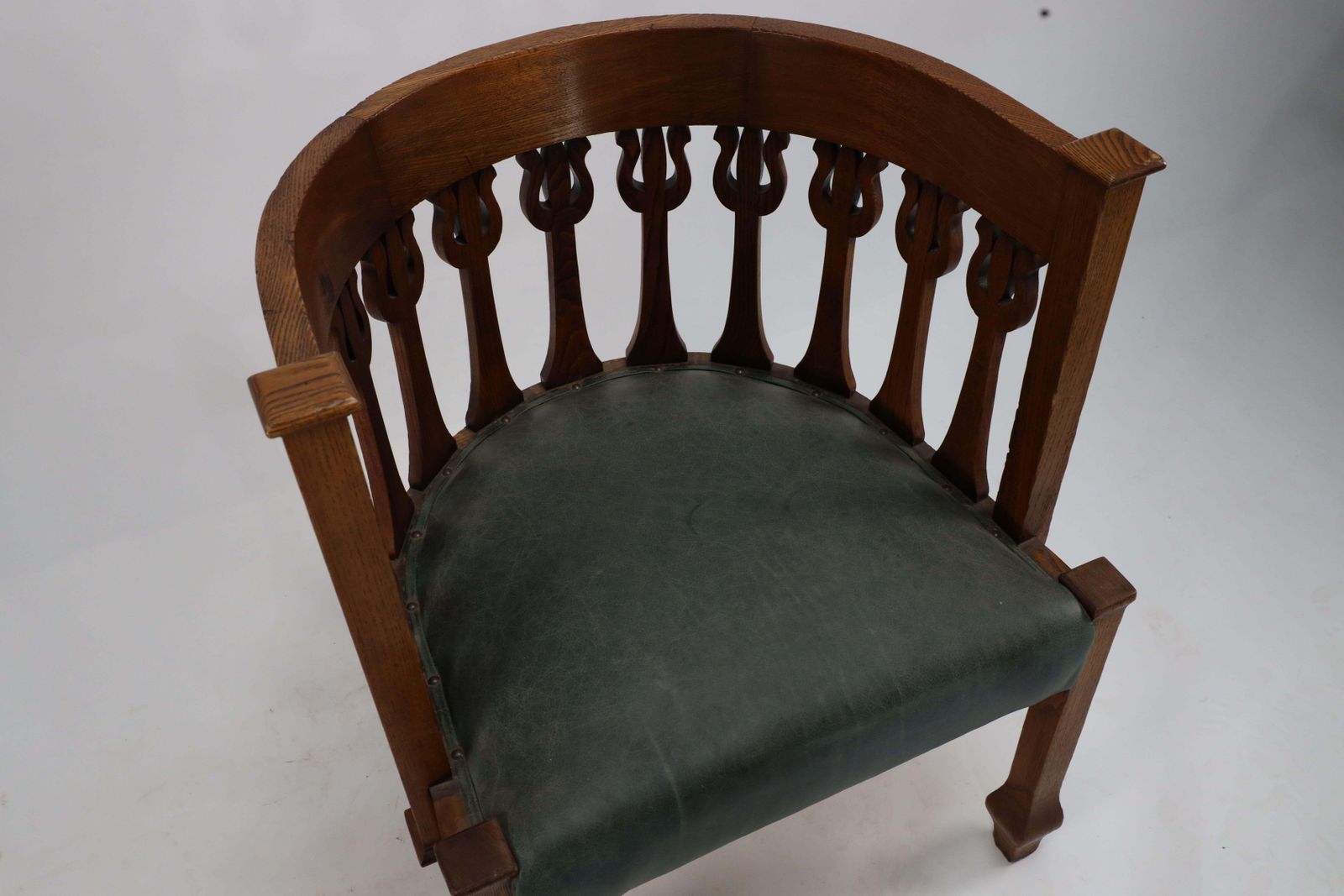 photo for sale An Arts And Crafts Oak Armchair With Stylized Floral Upright Decoration