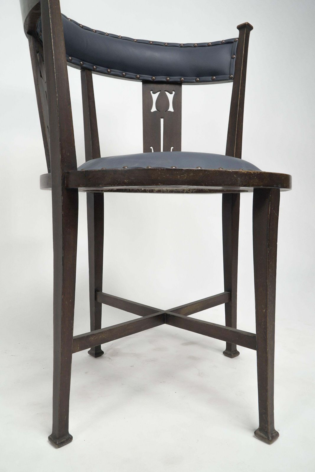 An Arts And Crafts Mahogany Tub Chair With Stylized Floral Cut Outs photo vintage