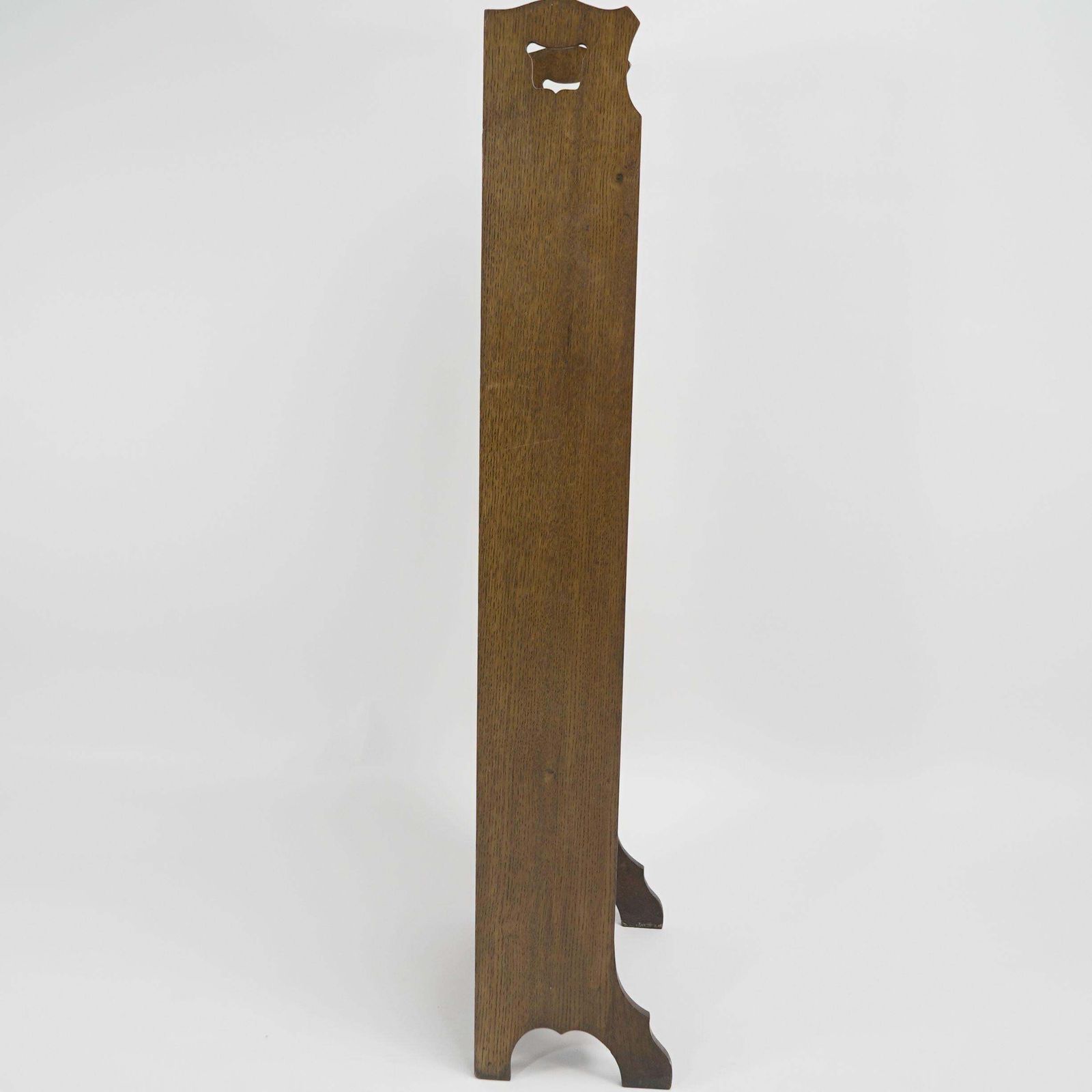 Liberty & Co. A Slim Arts And Crafts Oak Bookcase With Stylized Floral Cut Outs photo furniture