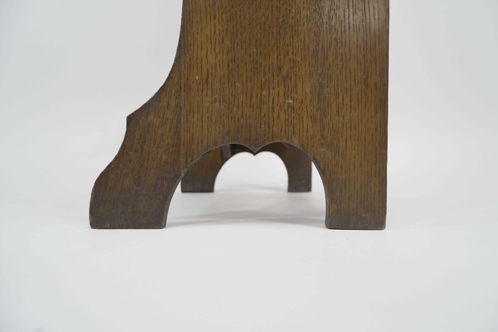 photo furniture Liberty & Co. A Slim Arts And Crafts Oak Bookcase With Stylized Floral Cut Outs