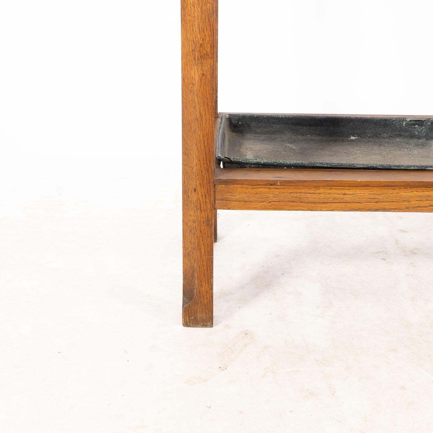 816.0 An Arts And Crafts Oak Stick And Umbrella Stand With Fourteen Sections photo