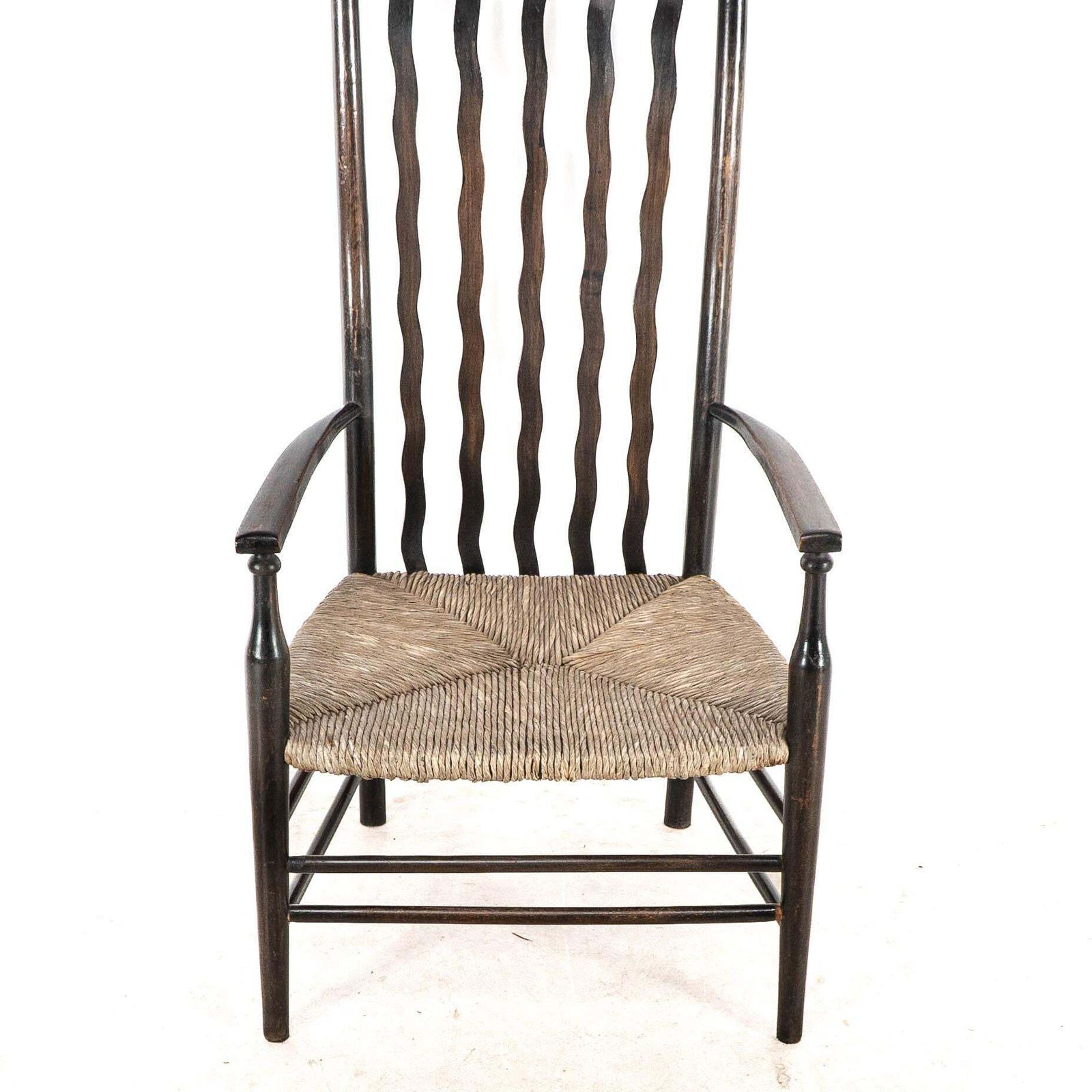 Liberty & Co. An Arts & Crafts Rush Seat Armchair With Wavy Shaped Back Slats photo buy