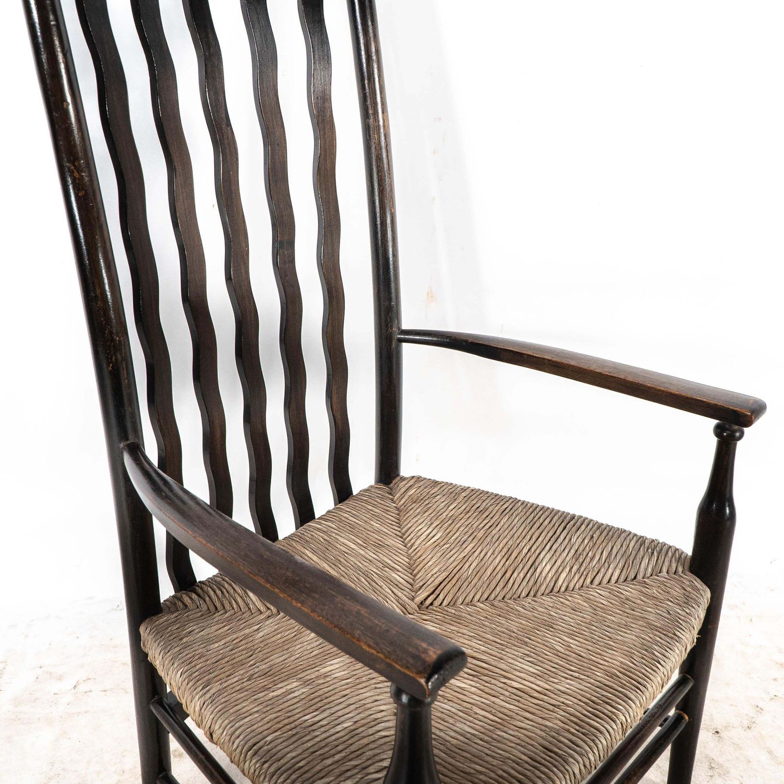 photo vintage Liberty & Co. An Arts & Crafts Rush Seat Armchair With Wavy Shaped Back Slats