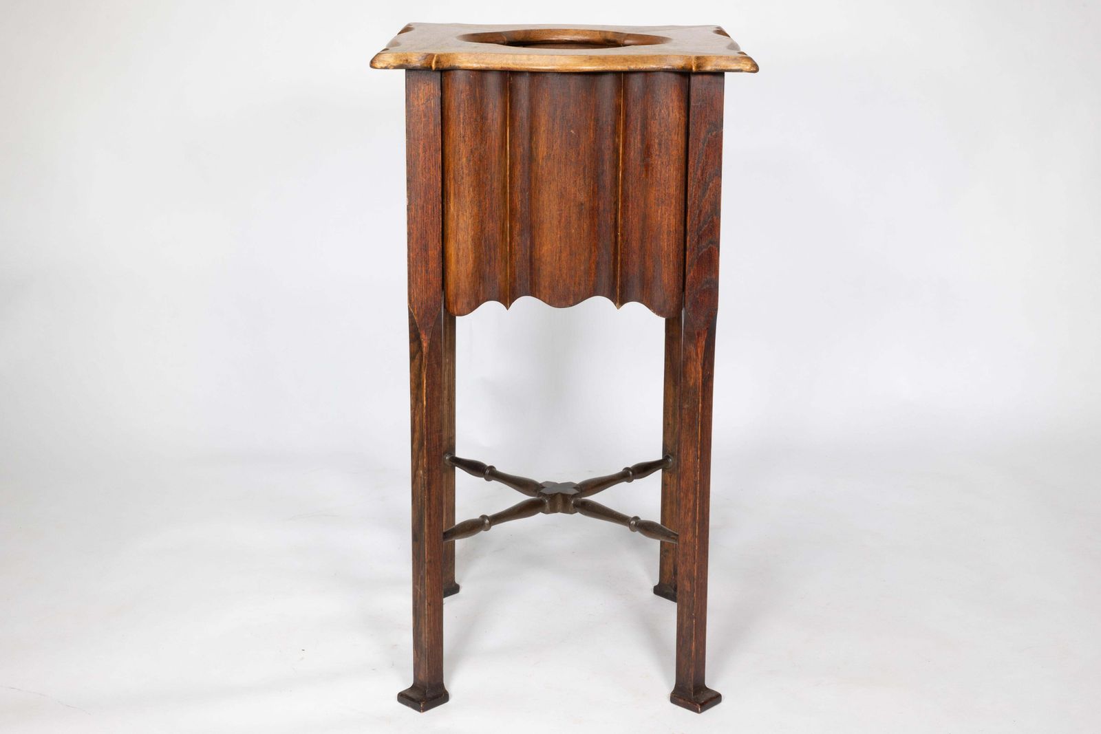 An Arts And Crafts Walnut Plant Stand With A Shaped Top And Ribbed Style Sides photo Home Decor