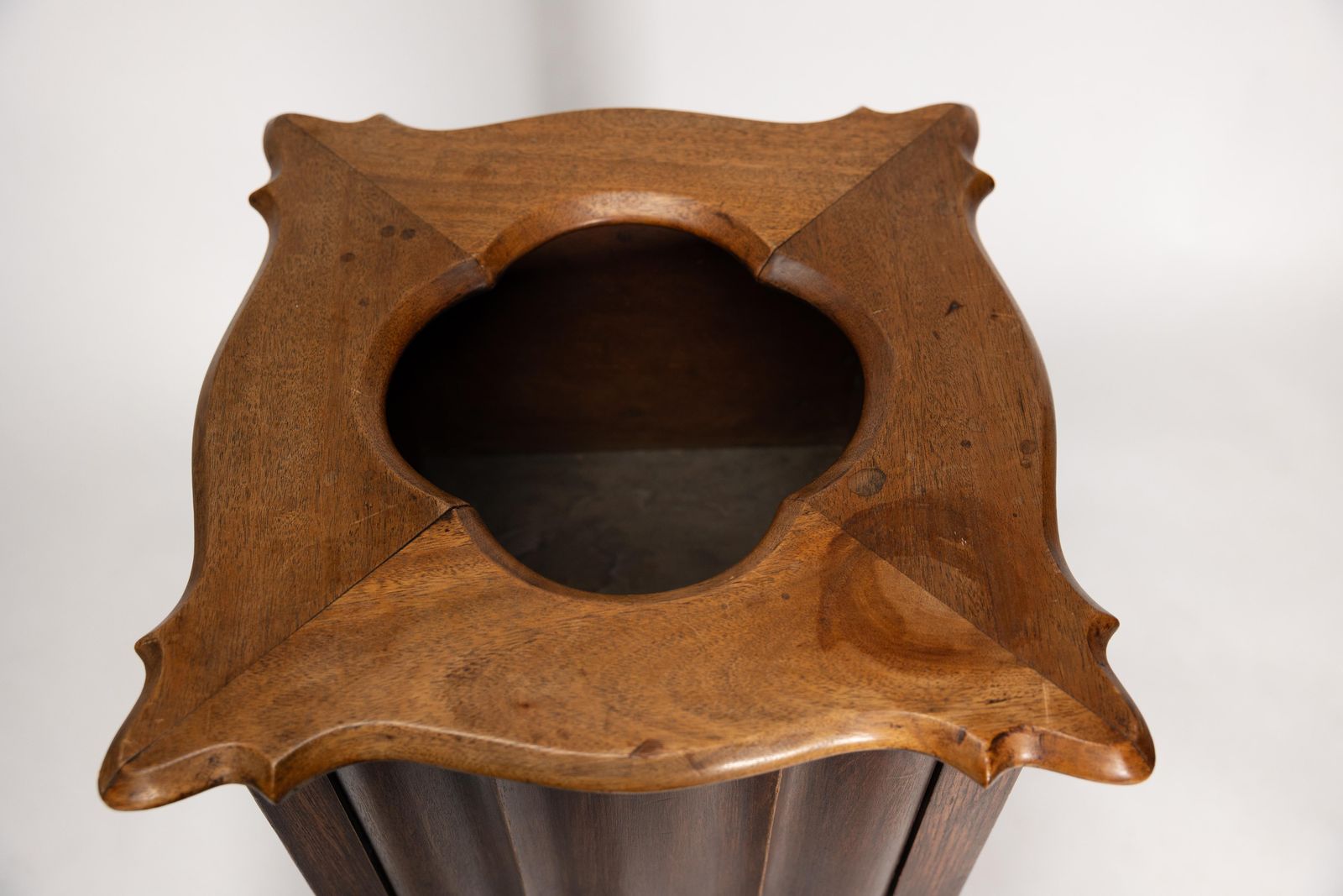 An Arts And Crafts Walnut Plant Stand With A Shaped Top And Ribbed Style Sides photo vintage