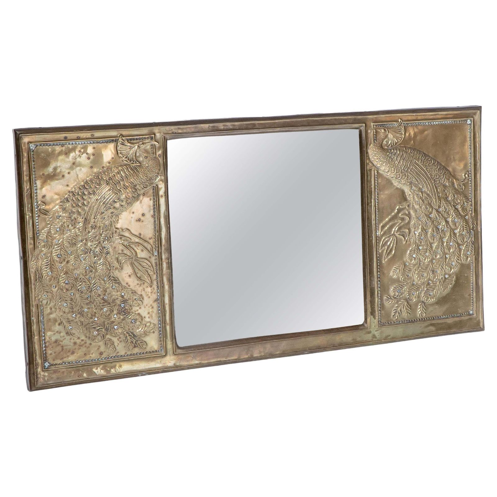 An Aesthetic Movement Brass Mirror With Stylized Peacocks Perched On A Branch