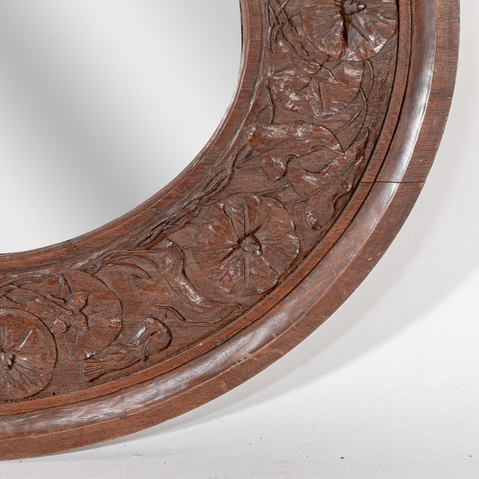 An Arts & Crafts Walnut Circular Mirror With Stylized Floral Carved Decoration photo vinterior