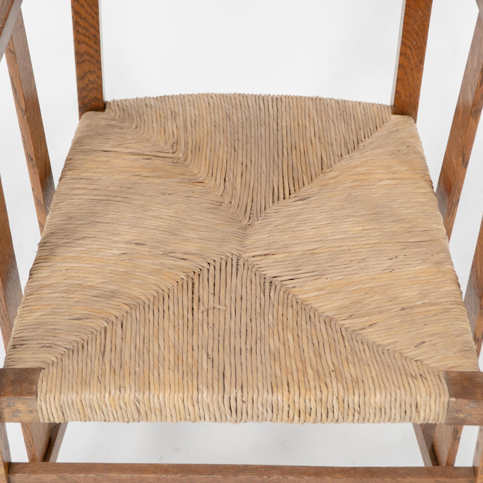 photo furniture Liberty & Co. An Arts & Crafts Rush Seat Armchair With A Shaped Back