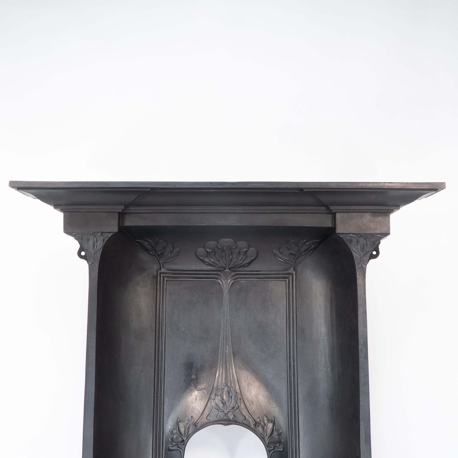 Arts & Crafts Cast Iron Fireplace With Curved Sides & Stylized Floral Decoration photo vinterior
